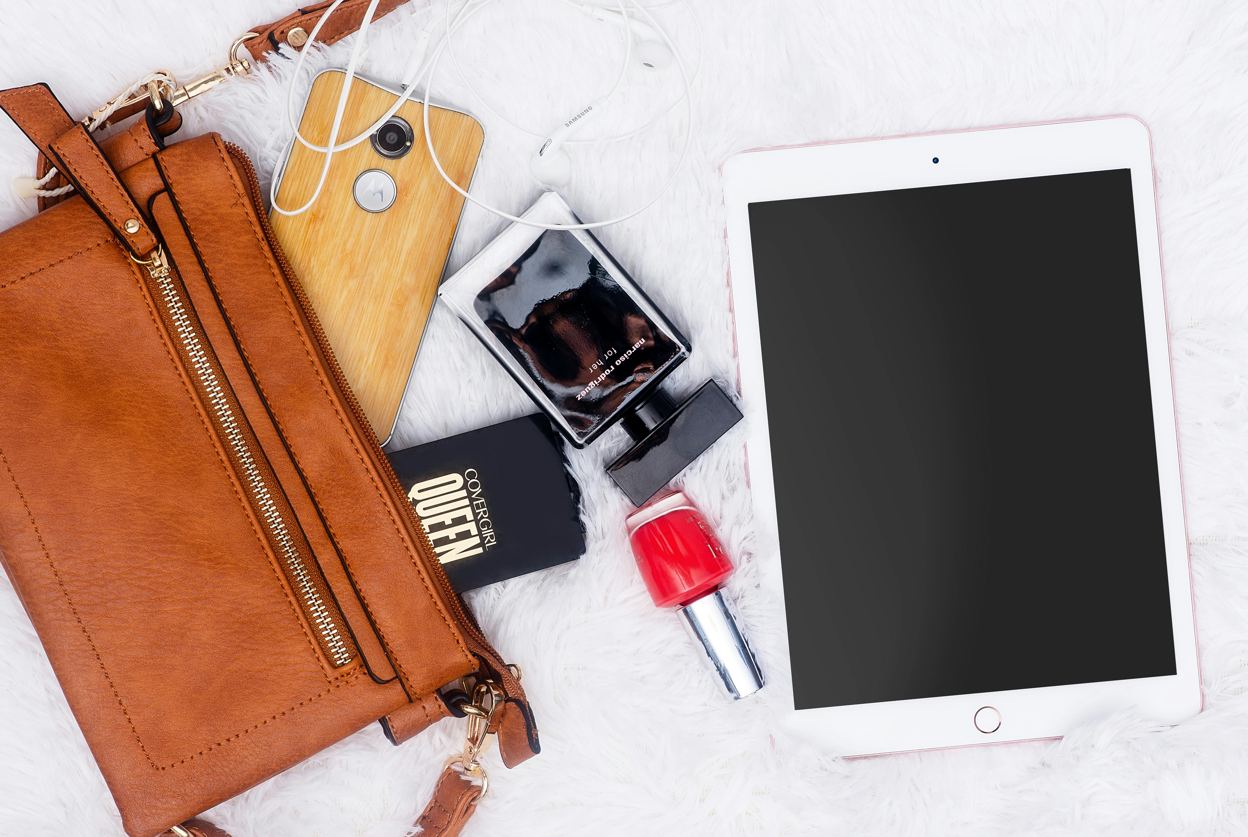 Bag with iPad, phone, nail polish and perfume