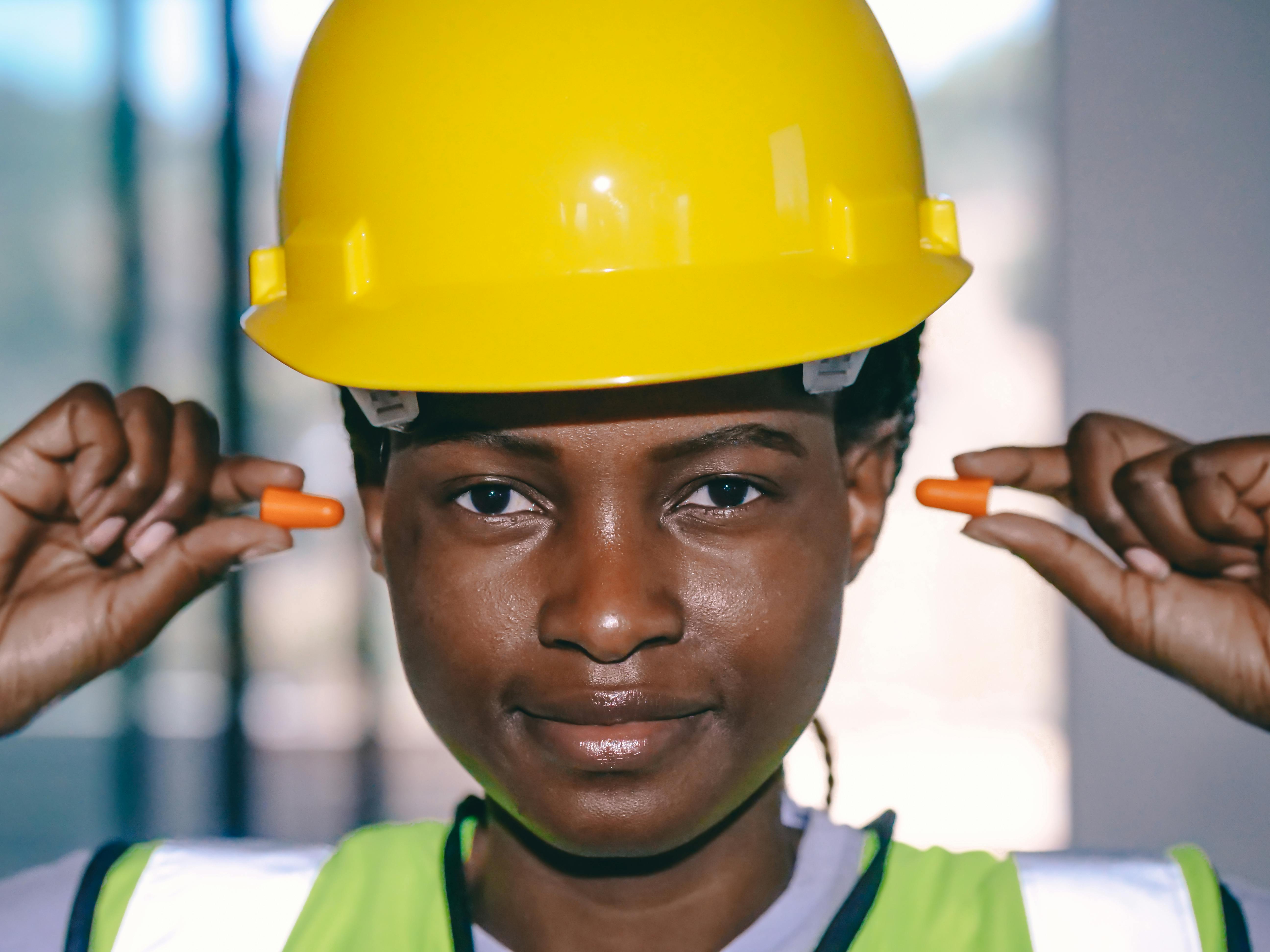 Person inserting ear plugs