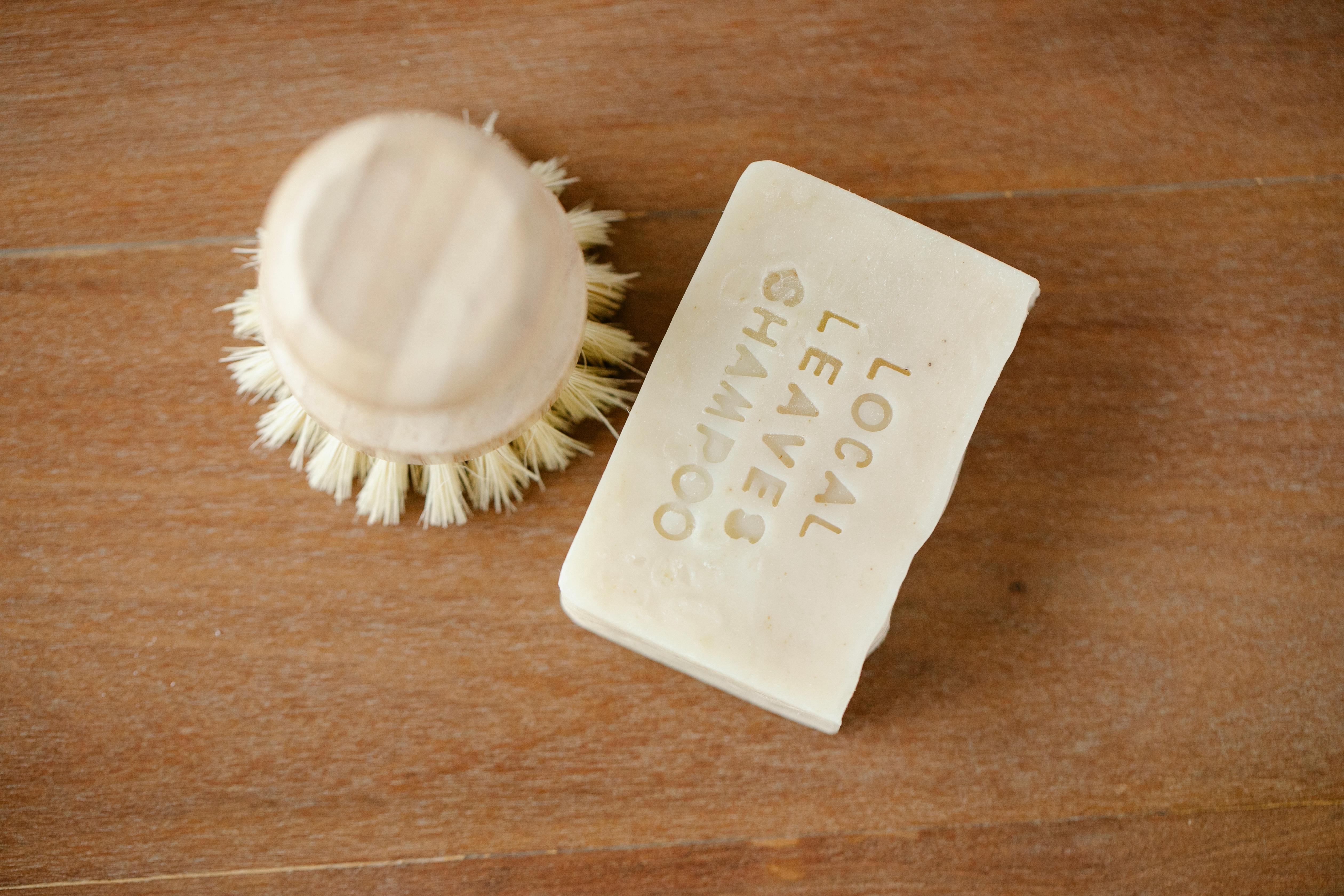 Shampoo Bar and Brush on Wooden Table